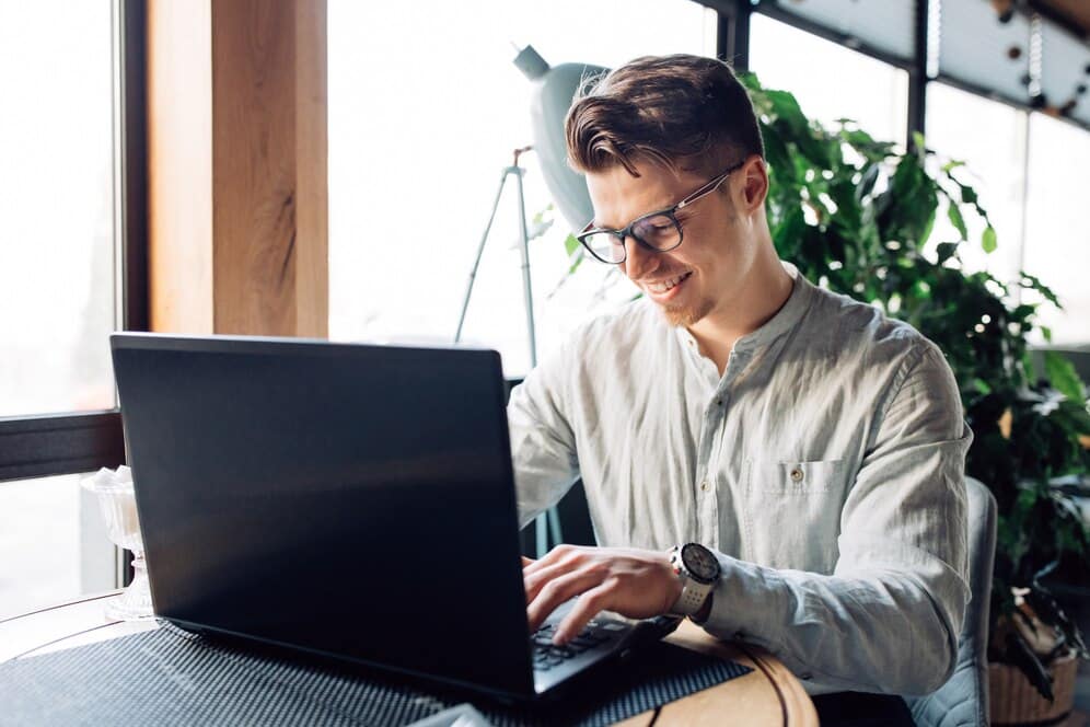 businessman-eyeglasses-working-laptop-typing